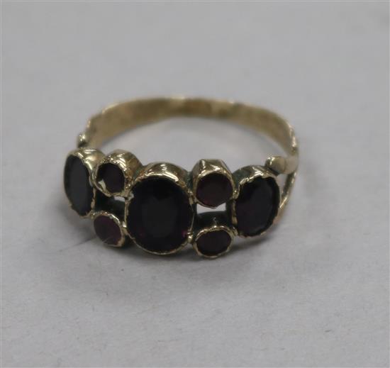 A George III yellow metal and foil backed gem set ring, with central doublet stone, size M.